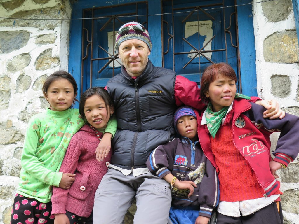Chris Miller with children in Nepal